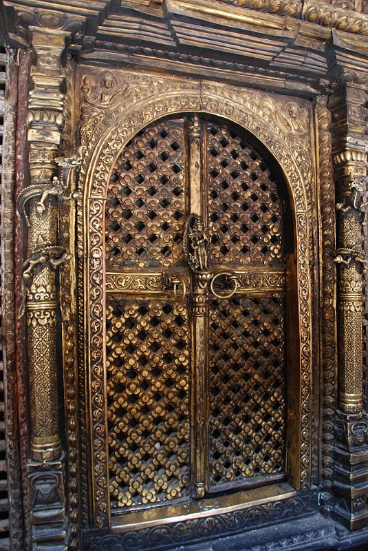 Kathmandu Patan Golden Temple 33 Swayambhu Chaitya Lattice Door The lattice doors of the Swayambhu Chaitya in the Golden Temple in Patan are very ornate.